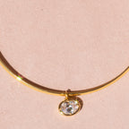 Gold Omega with Large Oval Charm