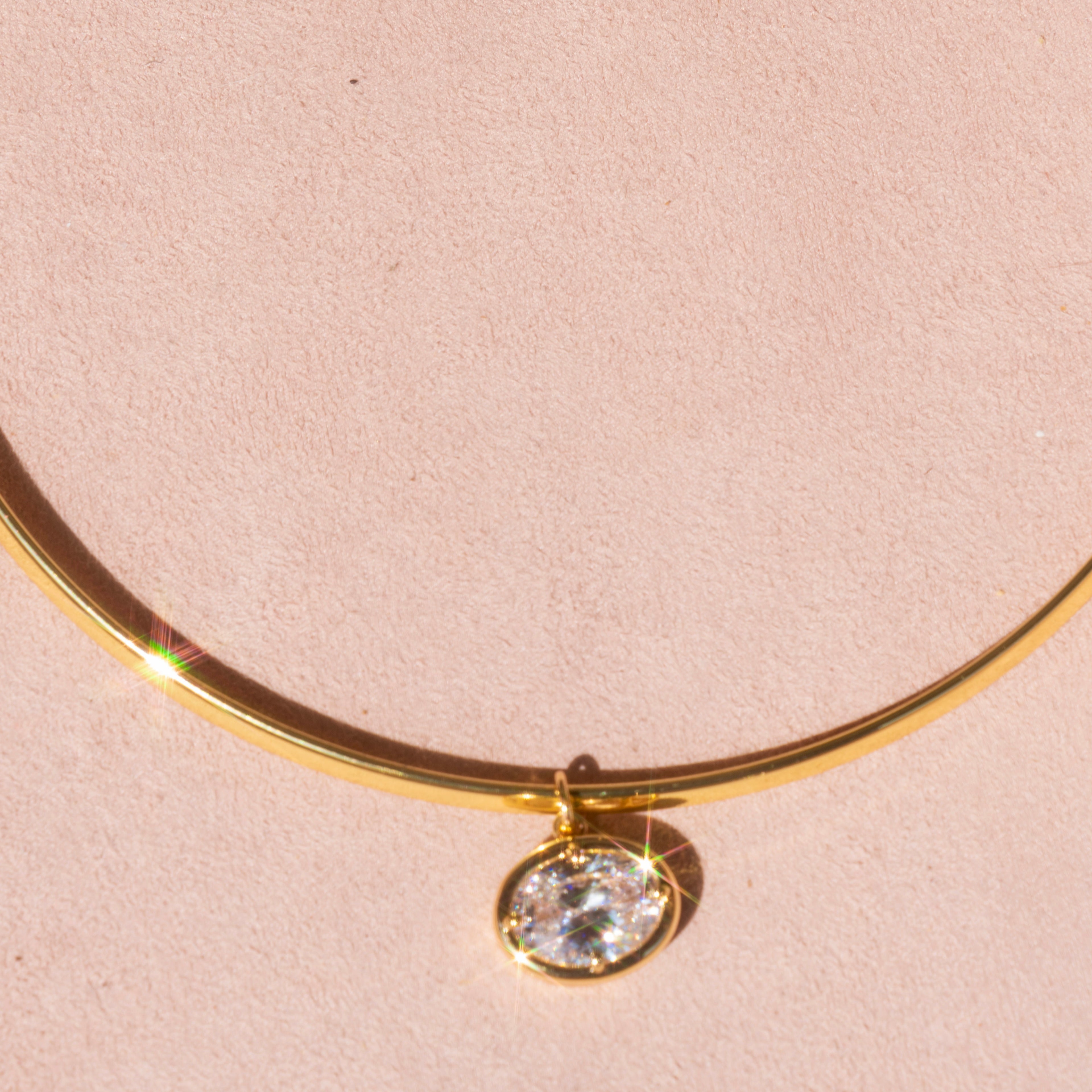 Gold Omega with Large Oval Charm